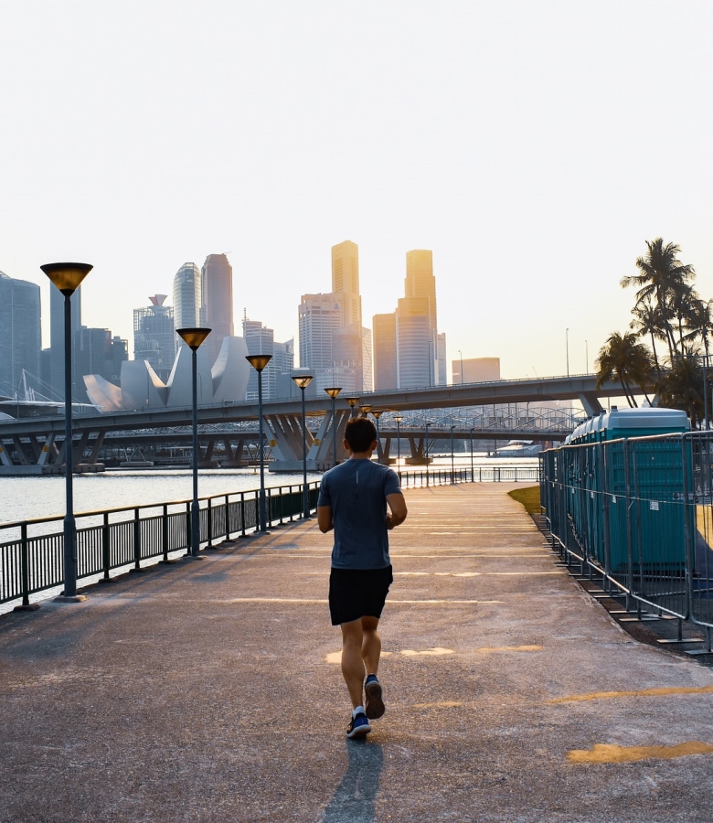 A man running under sun